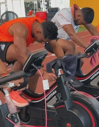 Pushing through the pain. A close-up of the athletes giving their all during a high-intensity interval on the Wattbikes.
