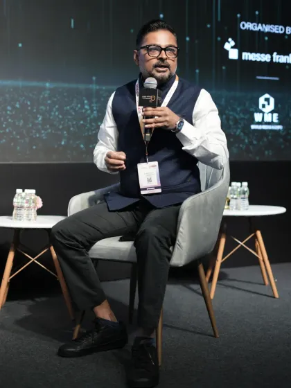 A panelist passionately makes a point during a discussion, showcasing the dynamic and engaging nature of our conference sessions.