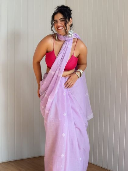 A full-length shot of a beautiful lavender saree from Dressfolk, paired with a bright pink bralette. This shows my signature style of using bold color combinations in Indian wear.