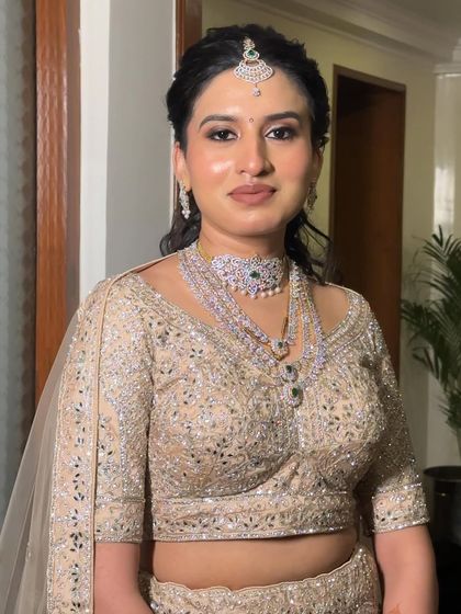 This bride's reception makeup is all about that natural glow. The skin is luminous and the features are softly defined, proving that minimal makeup can have a major impact.