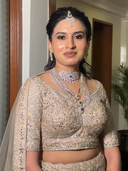 This bride's reception makeup is all about that natural glow. The skin is luminous and the features are softly defined, proving that minimal makeup can have a major impact.