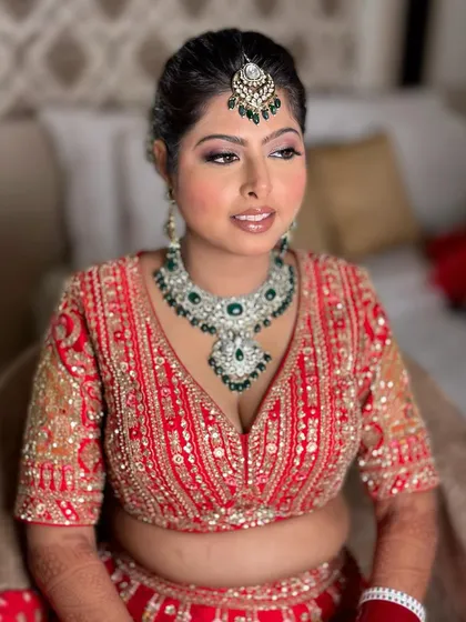 A detailed shot of the bridal makeup and hair. The elegant updo and radiant makeup create a truly regal look for the wedding day.