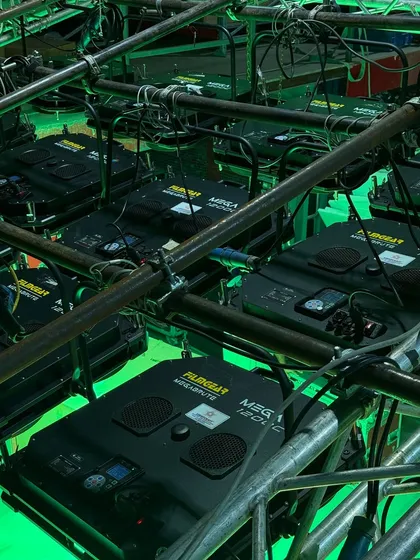 The back of the MegaBrute fixtures, showing the control panels and connections, all neatly rigged on a truss.