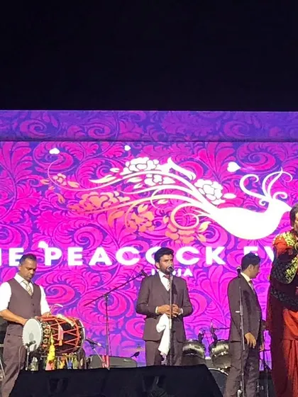 Capturing the moment. Gurdas Maan engaging with the crowd during the successful concert we organized. Our event management services include full artist liaison and on-stage support.