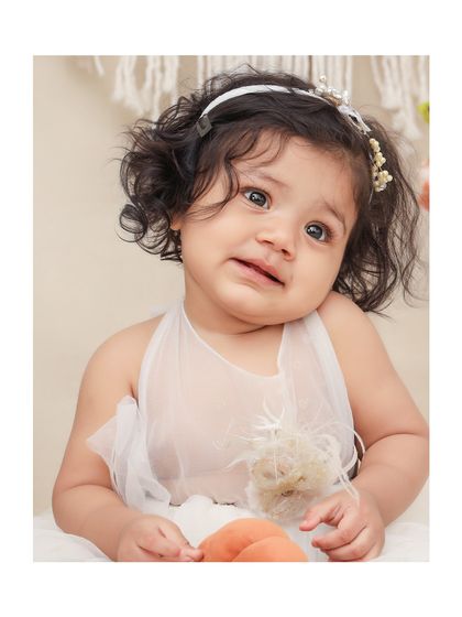 Even a pensive or emotional look can make for a beautiful and authentic portrait. I capture the full range of your baby's expressions.