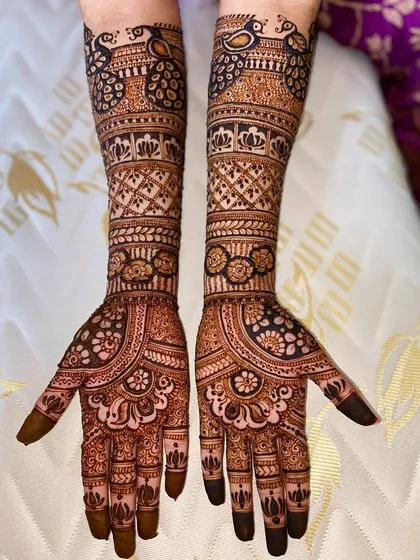 The same beautiful peacock design, showing the rich color of the henna stain.