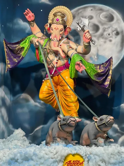 A powerful depiction of Ganpati against a moonlit sky. I use a combination of brushwork and spray painting to create dramatic, large-scale backdrops like this one for community pandals, making the entire space feel divine.