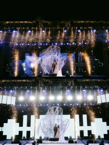 The full view of a spectacular Sangeet entry we planned, with a custom stage, pyrotechnics, and a unique heart-shaped structure. We bring your grandest ideas to life.