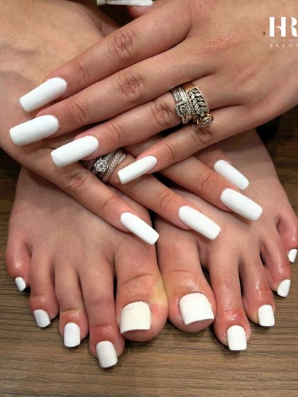 A matching set for a completely polished look. We provided a full manicure and pedicure with our crisp, opaque white gel polish for a clean and coordinated style from hands to feet.
