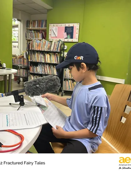 A student getting ready to record his podcast episode. The Fractured Fairytales project encourages students to play with characters, settings, and plots, fostering creativity and a love for storytelling.