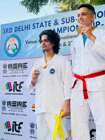 Two of our adult students on the podium, proving that it's never too late to compete and win.