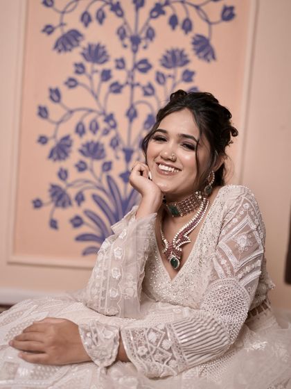 This is an elegant look for an engagement or sangeet. The client is wearing a beautiful white chikankari outfit. I did her nails in a matching simple white polish, which looks clean, modern, and sophisticated. It shows that nails don't always need to be bold to make a statement.