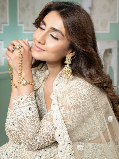 A close-up capturing the dreamy quality of the makeup. The soft focus on the eyes and the radiant skin are hallmarks of the sophisticated techniques our students learn.