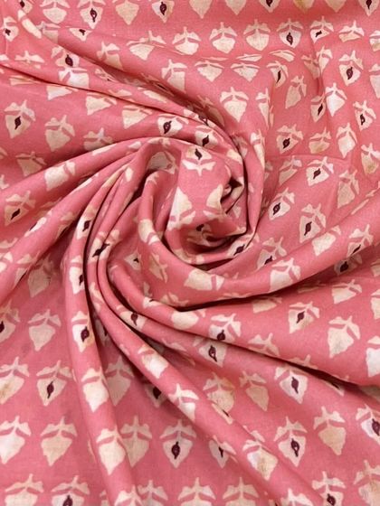 Our printed mul mul cotton in a lovely shade of pink with a delicate buti print. The fabric is incredibly soft, making it perfect for comfortable everyday wear.