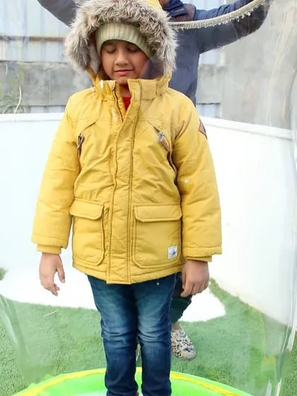 It's not just about decor, it's about the activities! Here, a child is having a blast inside a giant bubble, one of the many fun experiences I can arrange for any party.