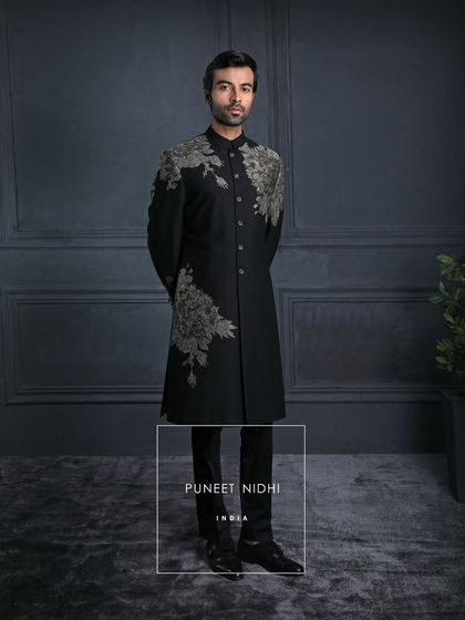 In the dark canvas of black, the embroidery blooms like light. A perfect balance of power and poetry, crafted for the modern gentleman.