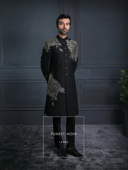 In the dark canvas of black, the embroidery blooms like light. A perfect balance of power and poetry, crafted for the modern gentleman.