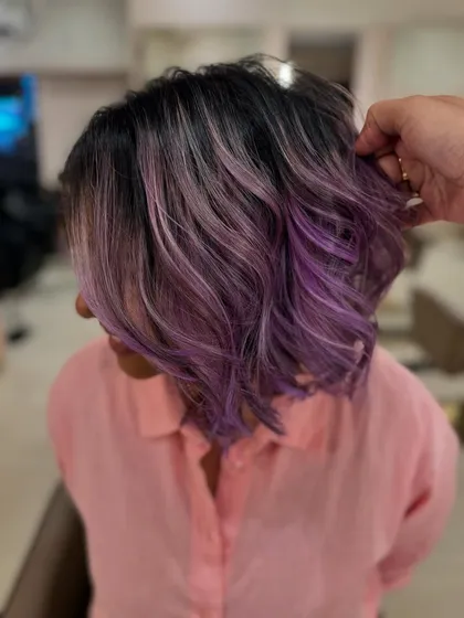 A close-up of the fresh lilac tones. The soft waves help to blend the colors beautifully.