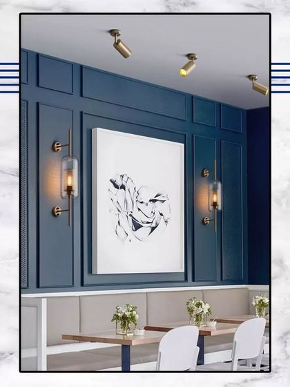 Unlocking the doors to luxury living. This design concept shows how bold wall colors and modern art can be combined with classic paneling for a dramatic, stylish effect.