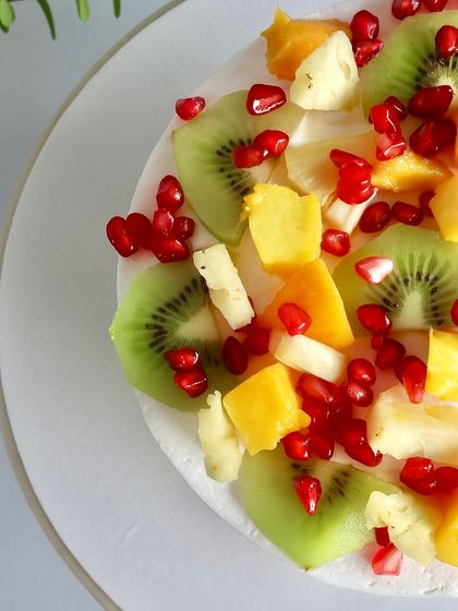 This is where the Naked Cake series begins: the Fresh Fruit cake. It features a soft vanilla sponge layered with a variety of seasonal fruits like kiwi, pomegranate, and mango, all held together with a light and silky diplomat cream. It’s refreshing, beautiful, and lets the quality of the fruit do the talking.