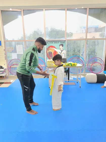 A handshake for a new yellow belt.