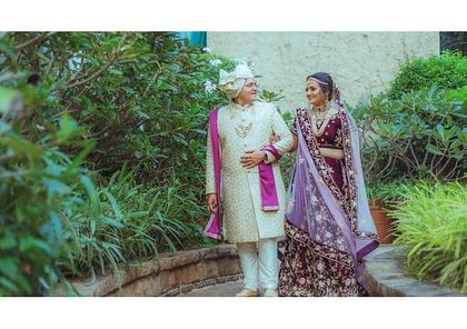 A candid shot of the couple taking a stroll through the venue's garden. These relaxed, walking shots result in natural and happy photographs.