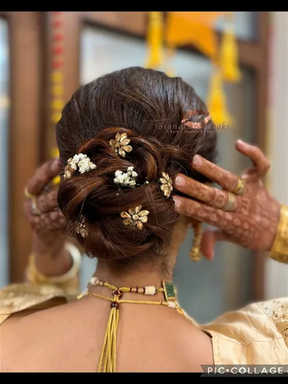 A close-up of the beautiful twisted bun. I used small, gold-toned floral accessories and baby's breath to add a touch of sparkle and softness.