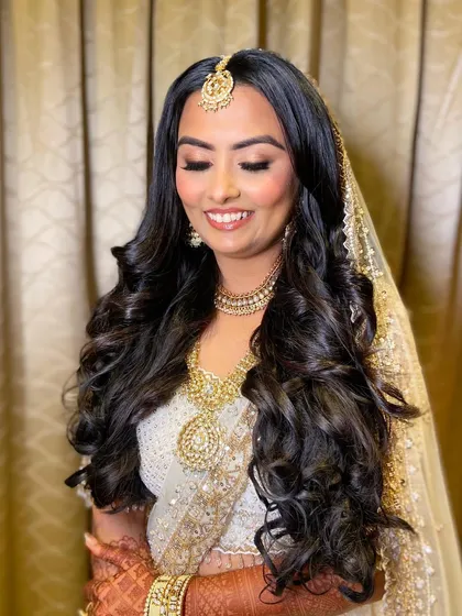 A close-up of Bansi's eye makeup, featuring a soft blend of bronze and gold shadows for a warm, romantic feel.