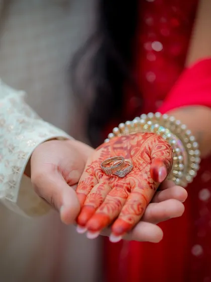The wedding rings held in the bride's henna-adorned palm. I believe the small details tell a big story, so I always take time to photograph the rings, mehndi, and other elements that you've so carefully chosen for your day.