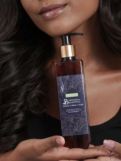 This is our hero product, the Bhringraj Shampoo, designed to give your hair volume, shine, and strength. It's a sulfate-free Ayurvedic formula that gently cleanses without stripping natural oils, making it perfect for tackling hair fall and nourishing the scalp.