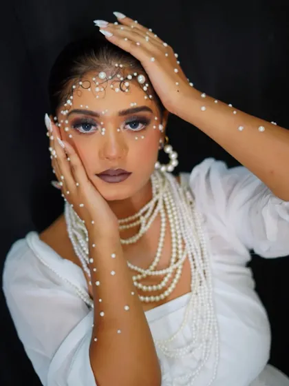 This is where makeup meets high fashion. Our editorial makeup module teaches students to create striking, conceptual looks like this pearl-adorned masterpiece, preparing them for the world of fashion shoots and runway shows.