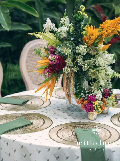 A tablescape from the 'Garden of Gaia' event, with a beautiful mix of tropical flowers.
