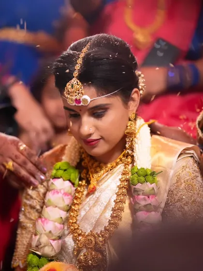 My makeup is designed to look beautiful not just in portraits, but during the wedding rituals too. This candid moment from a muhurtham ceremony shows how the makeup stays perfect and photographs beautifully.