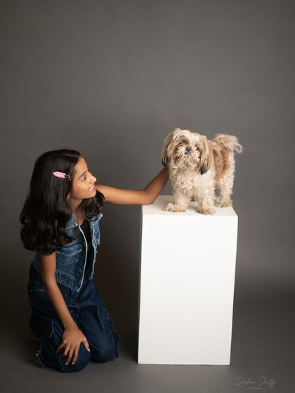 A girl and her best friend. This sweet black and white portrait with her dog is a heartwarming capture of their special bond.
