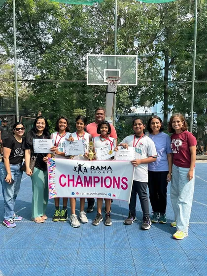 The Crossovers U-12 girls team, along with their coaches and proud parents, posing as champions at the Rama Sports Nerul tournament.