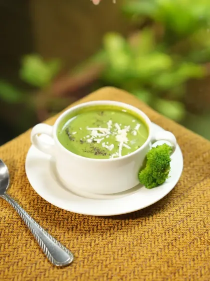 Another comforting bowl of our Broccoli Cheese Soup, garnished with grated cheese. It's the perfect dish for those cozy moments when you crave flavor and warmth.