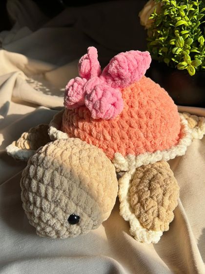 Our butterfly turtle is a favorite for gifts. The combination of soft colors and the cute bow detail makes it extra special.