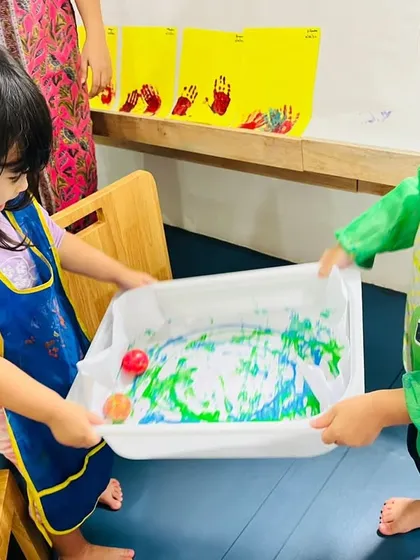 Collaboration is at the heart of our activities. In this marble painting project, two children work together, learning to coordinate and communicate while creating something beautiful. This is a great example of our focus on social skills enrichment through play.