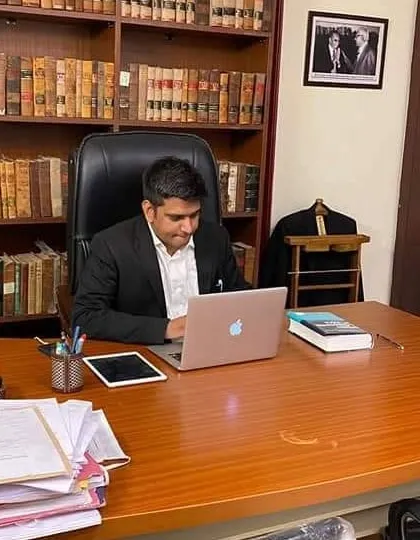 At my desk in the Defence Colony office. A well-organized space is essential for the focused work that our profession demands.