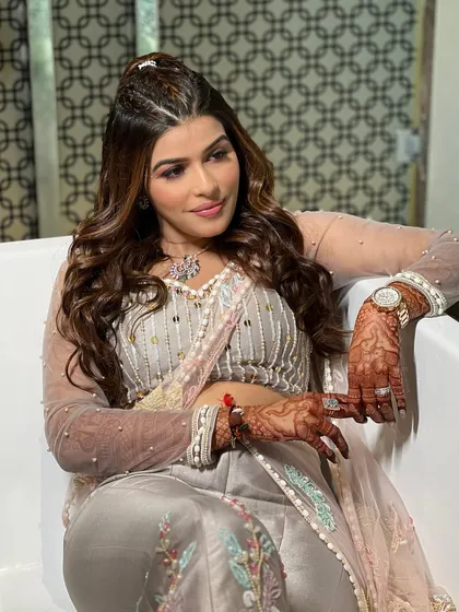 The bride's happy expression says it all. This look is all about feeling comfortable, confident, and ready to dance the night away.