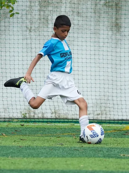 Another look at a player practicing his striking technique, a core skill we focus on from a young age.