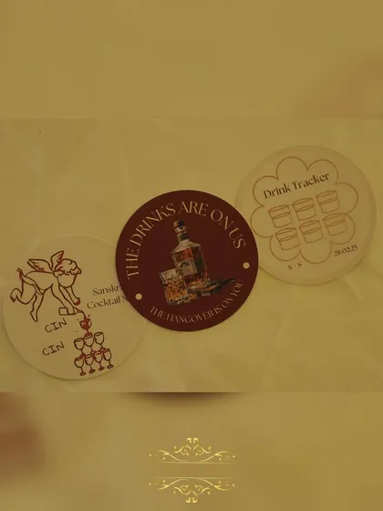 We love adding fun, personal touches. These custom coasters with witty phrases like "The drinks are on us, the hangover is on you" are always a hit with guests.