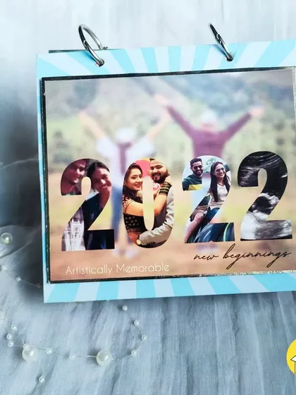 The 2022 cover page for my ring-bound calendar, featuring a cool photo collage inside the numbers.