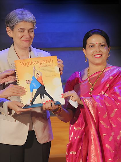 A proud moment presenting my book at a global forum. This work, inspired by Guruji's teachings, was created to make the science of yoga accessible to all, including the visually impaired.