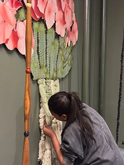 A close-up of me working on the intricate threadwork of a mixed-media installation. This hands-on process is where the sketch begins to take on its final, tangible form.