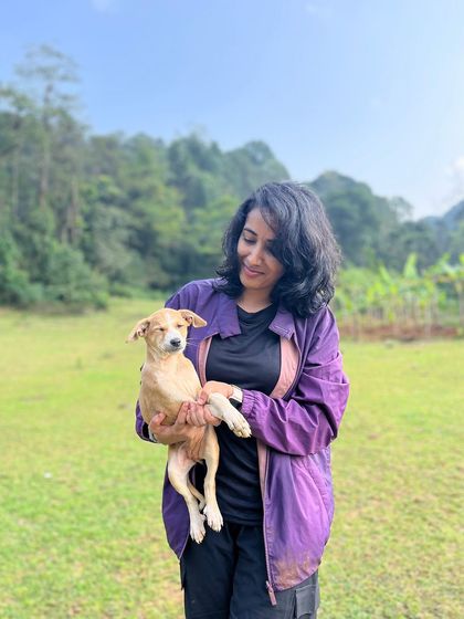 A trekker holds a cute puppy that joined our group on the Kodachadri trail.