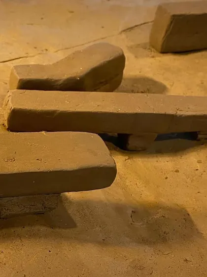 Another arrangement of clay models, exploring different spatial relationships.