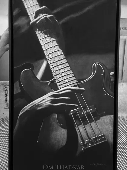 This drawing of a bass guitarist is all about the connection between the player and the instrument. The hands, the frets, and the strings are all rendered in detail to show the moment just before a note is played.
