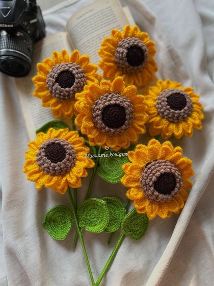 A handful of our 3D crochet sunflowers, perfect for creating your own custom bouquet or arrangement. Mix and match to create a personalized floral display.