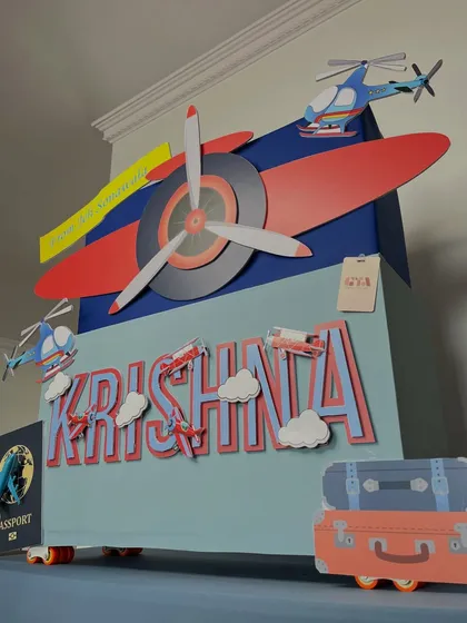 This perspective emphasizes the grand scale of the airplane-themed gift, making it look like a true monument to a child's imagination and love for adventure.